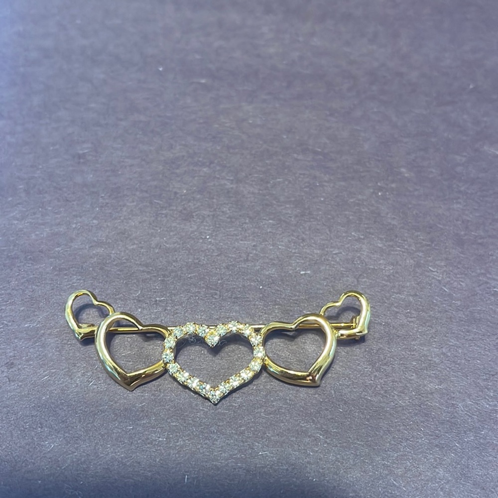 Goldtone and rhinestone pin